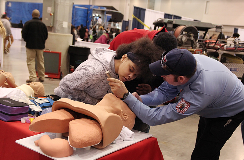 career fair day with student and ems worker